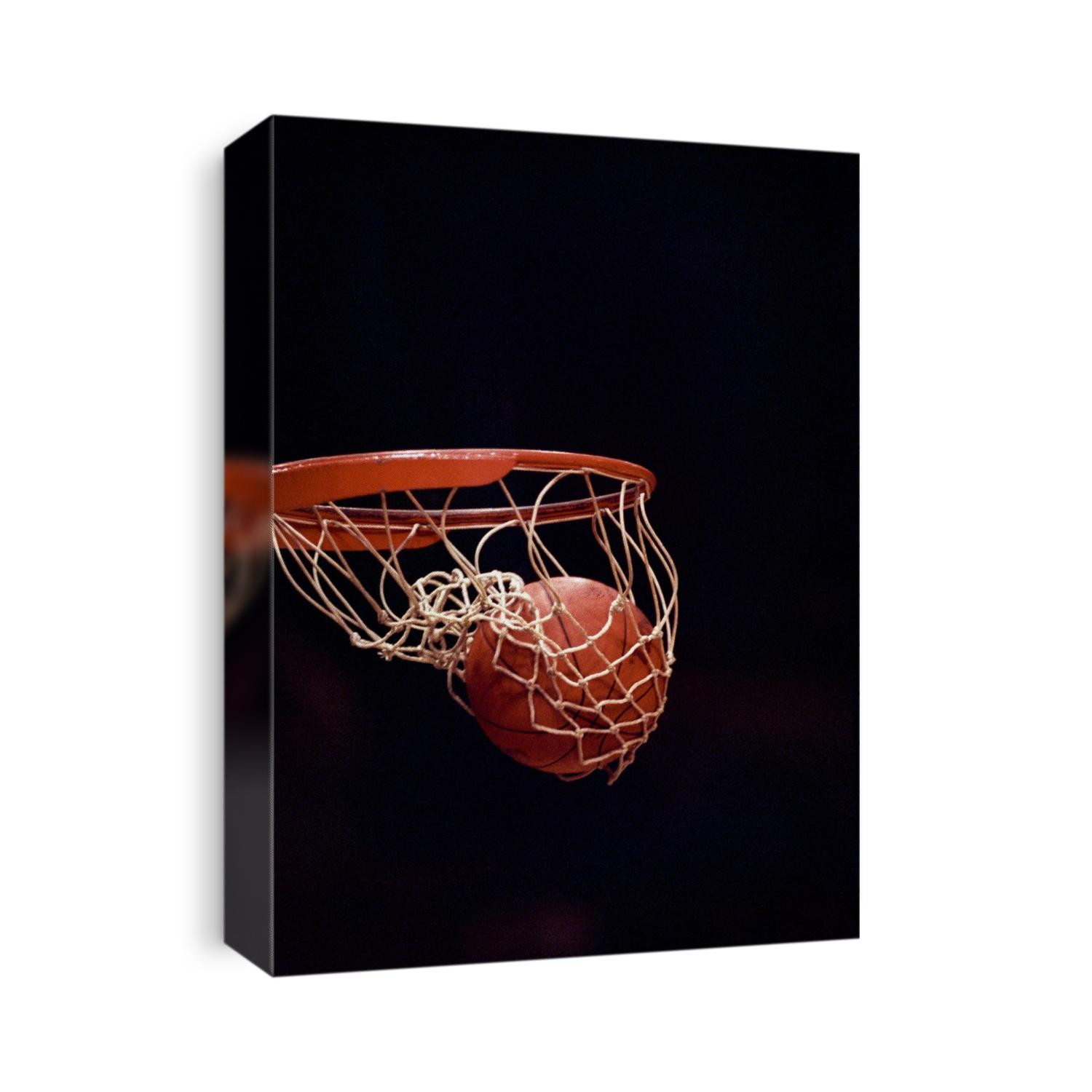 Basketball going through the hoop.