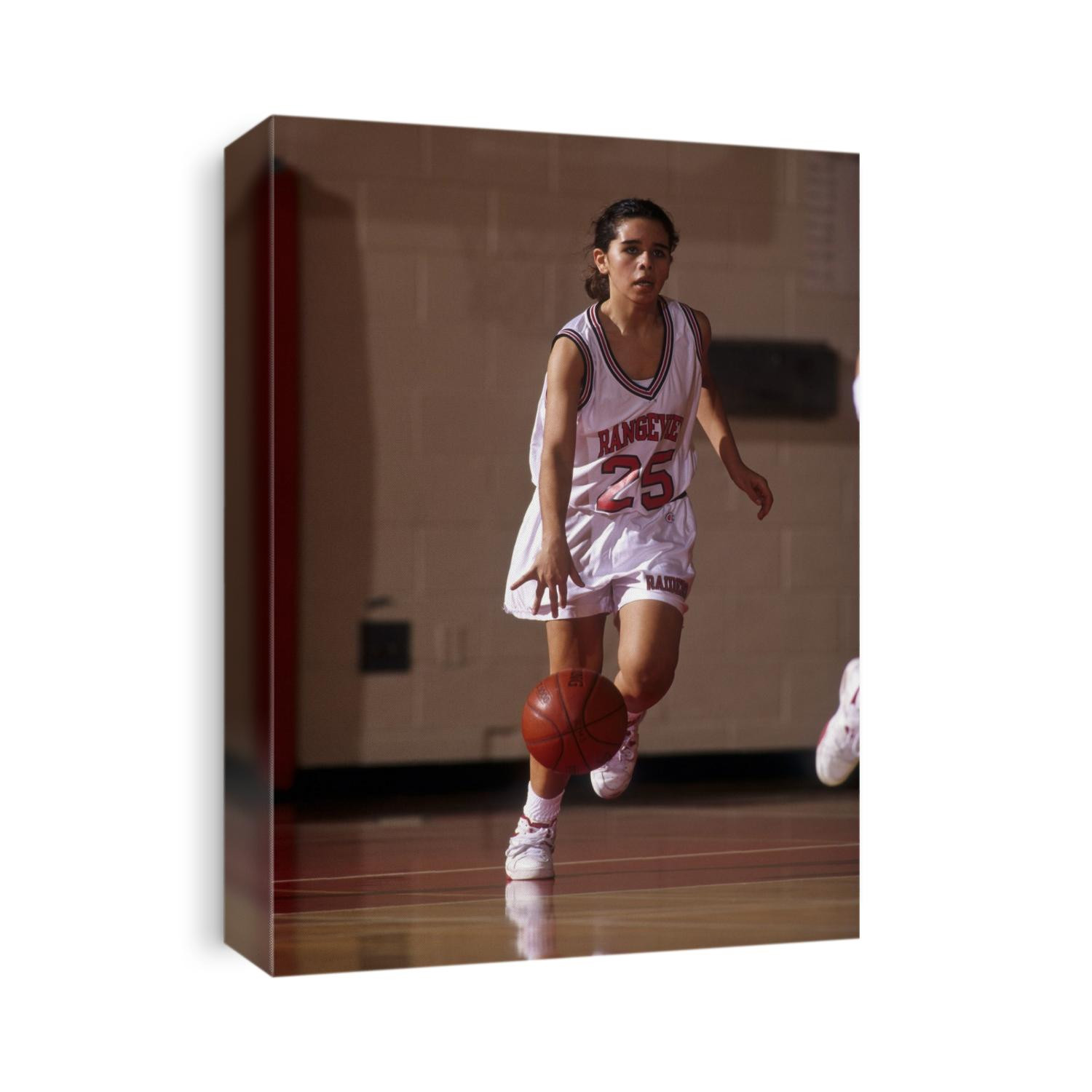 High Scholl girls basketball player in action.