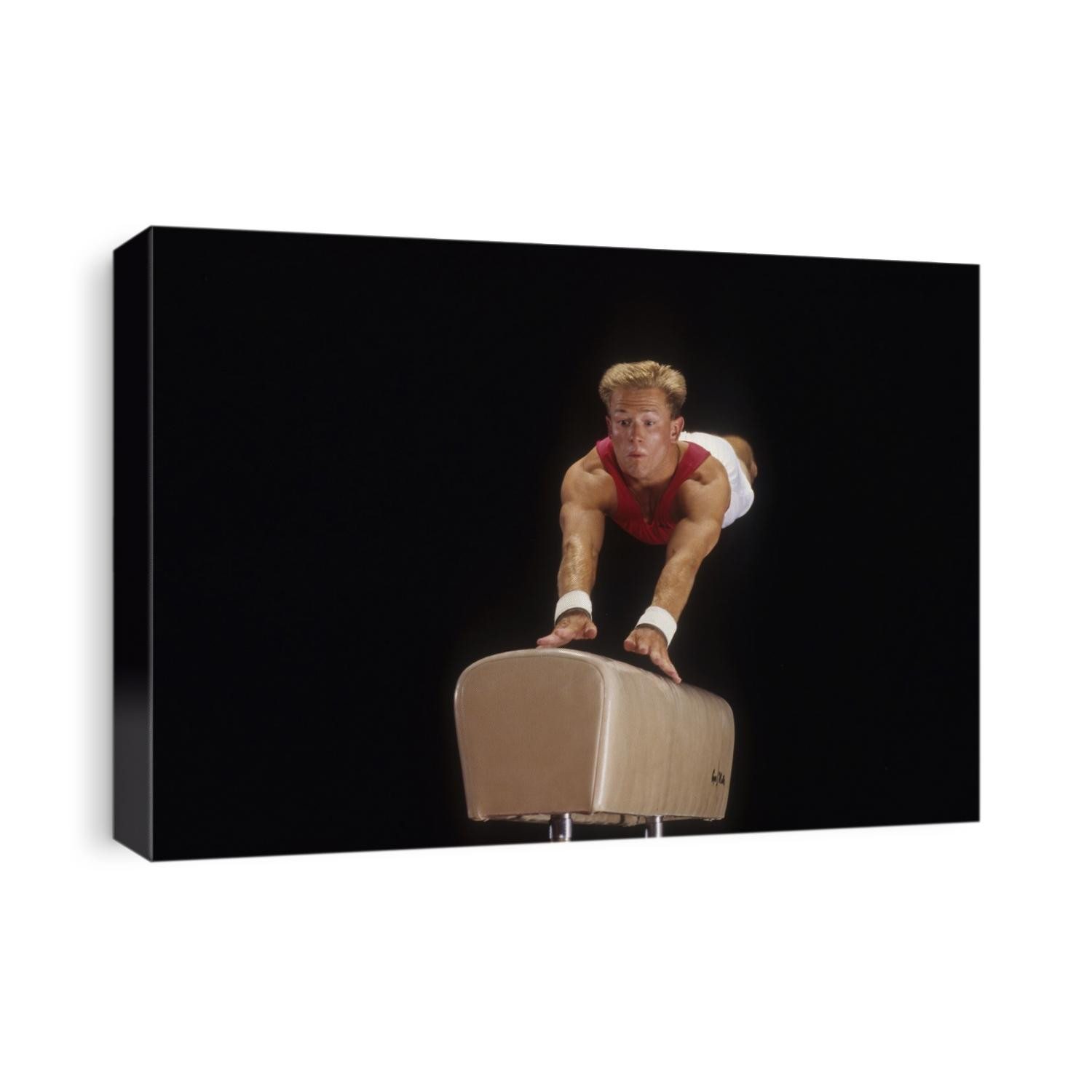 Male gymnast on the vault.