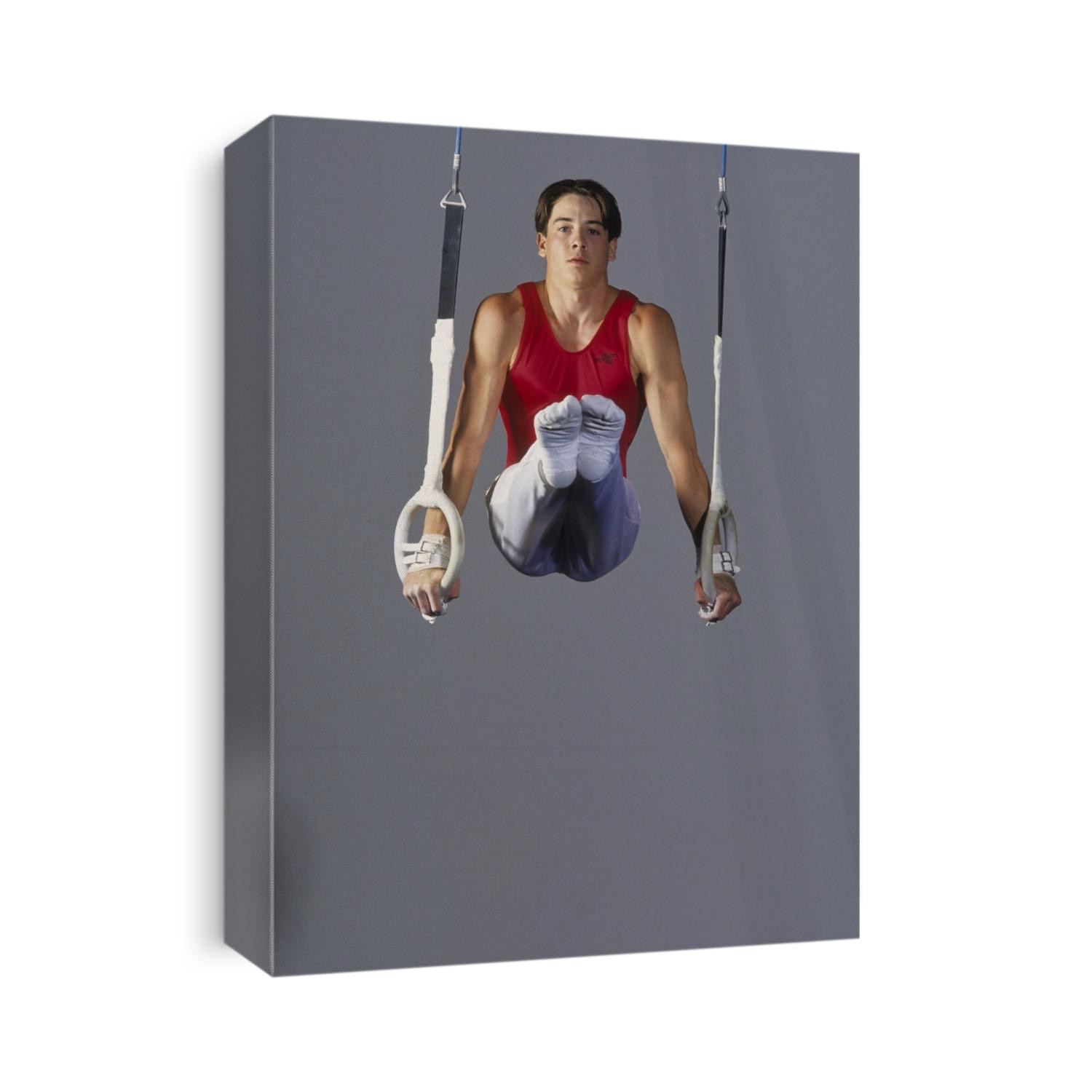 Male gymnast on the rings.