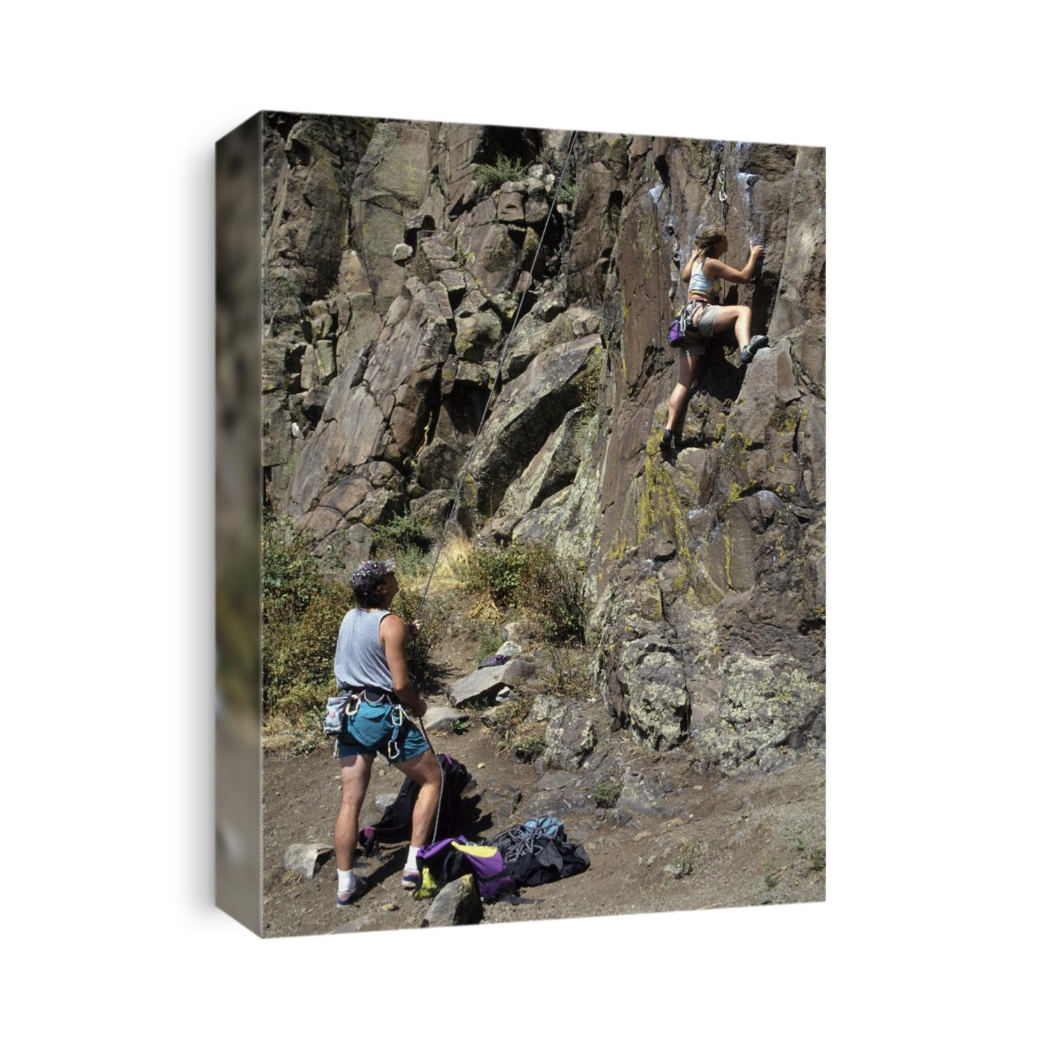 Rock climbers begin an ascend.