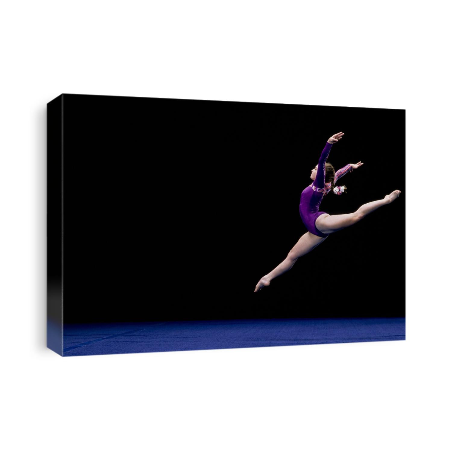 female gymnast performing on the floor exercise.