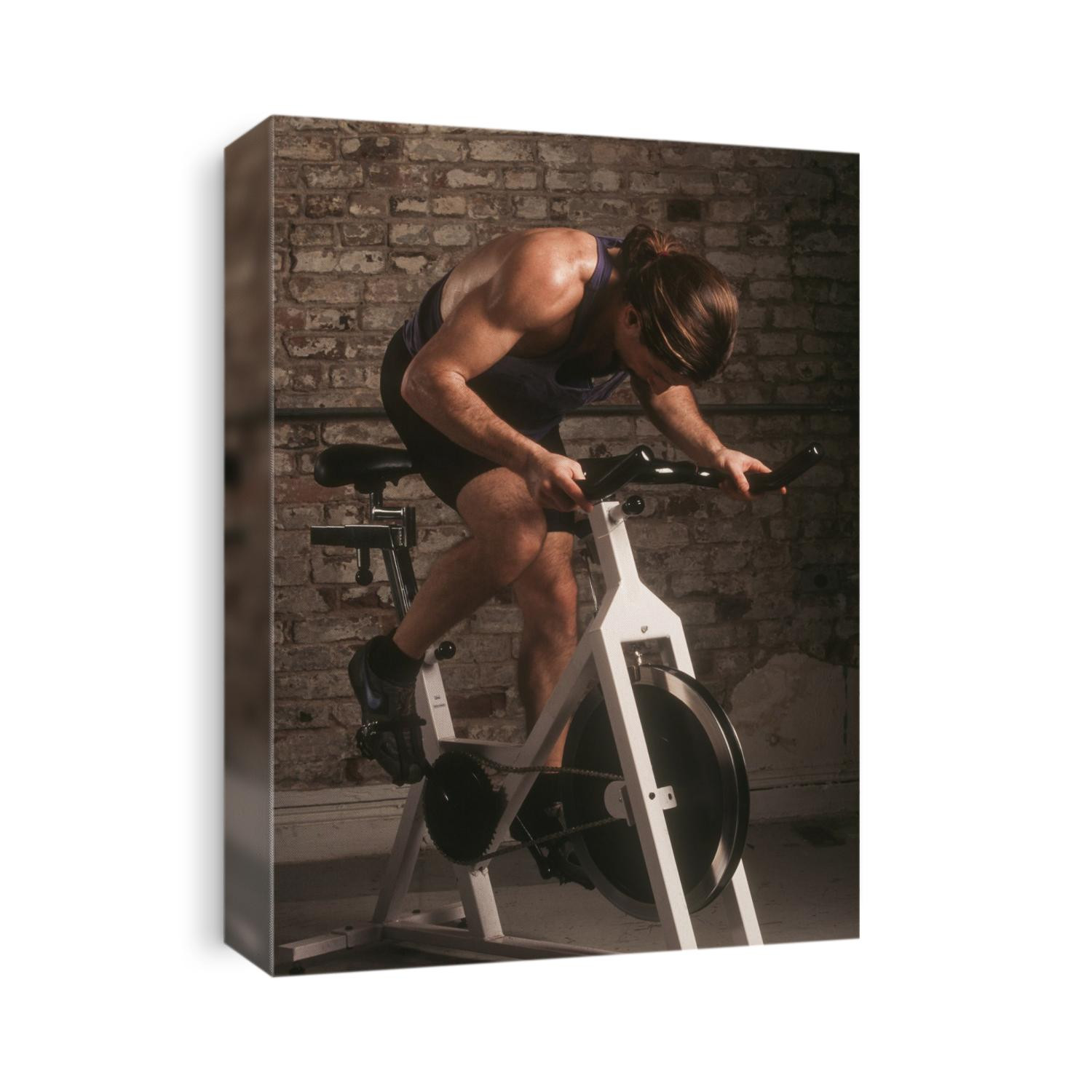 Adult male exercising on a stationary bike.