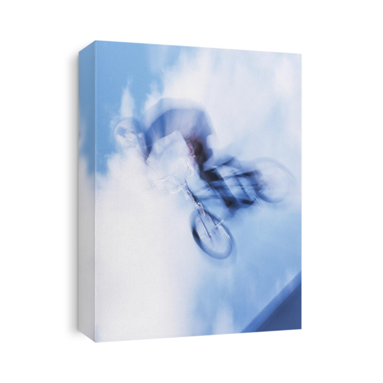 Teenage boy flys over the vert on a BMX bike.
