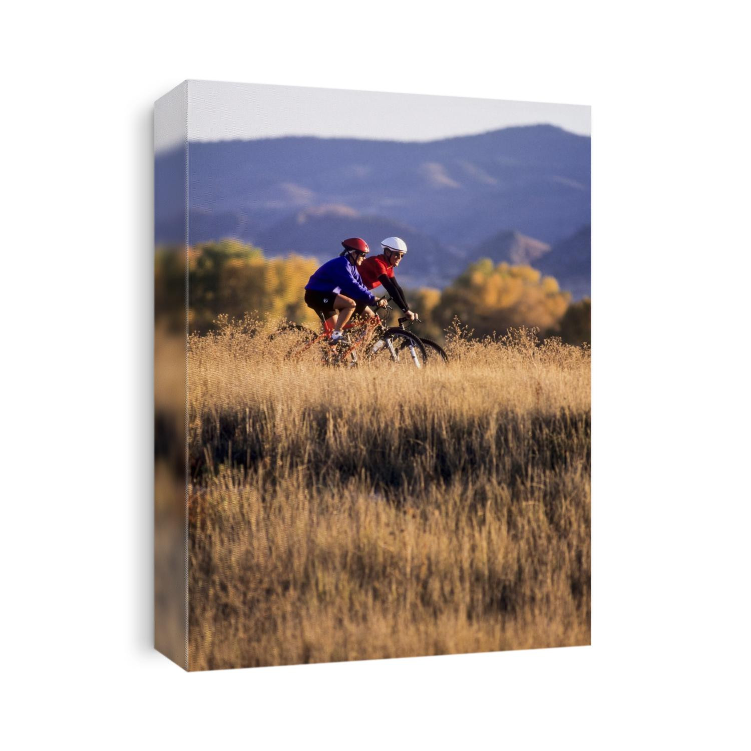 Couple mountain biking in Fall.