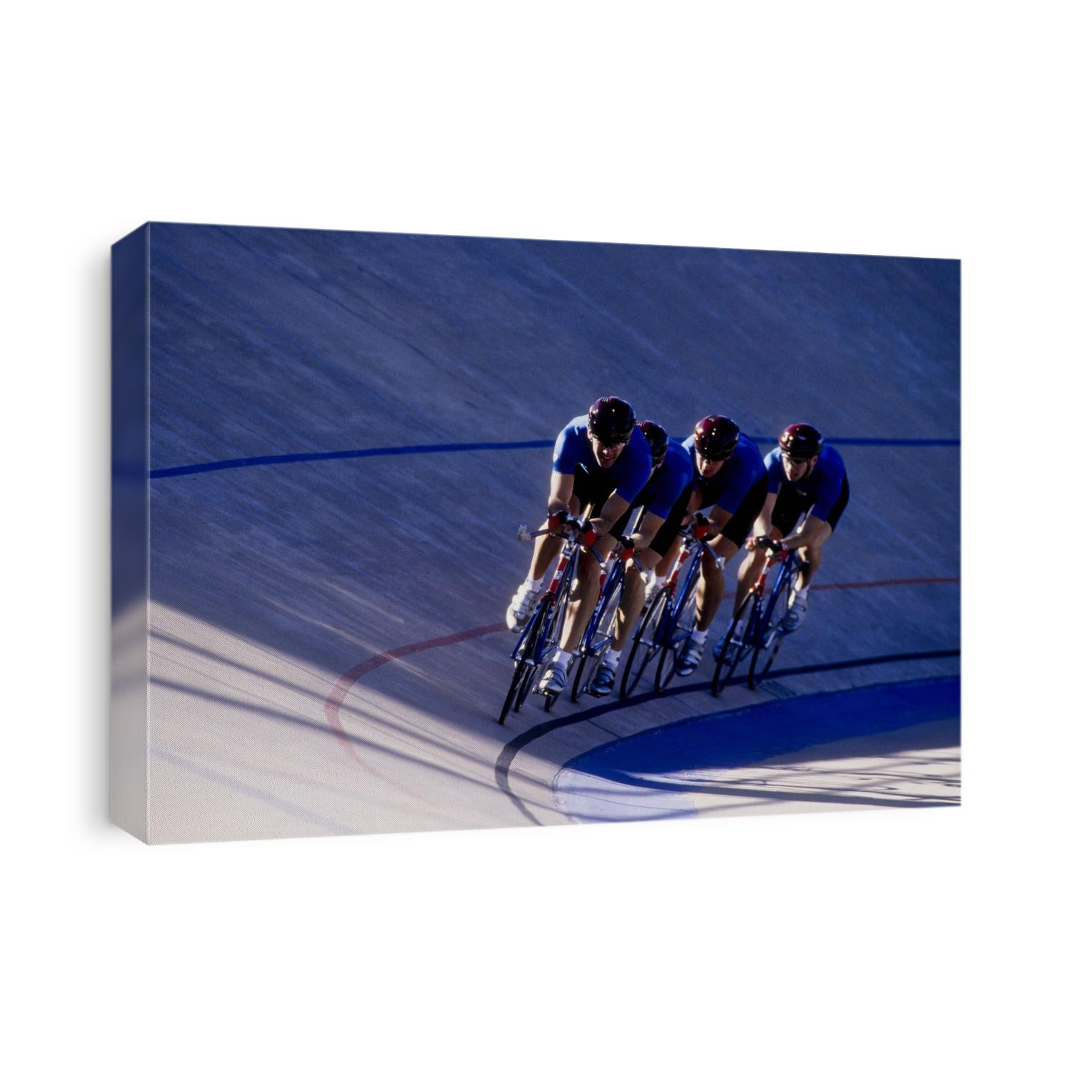 Cycling team competing on the velodrome track.