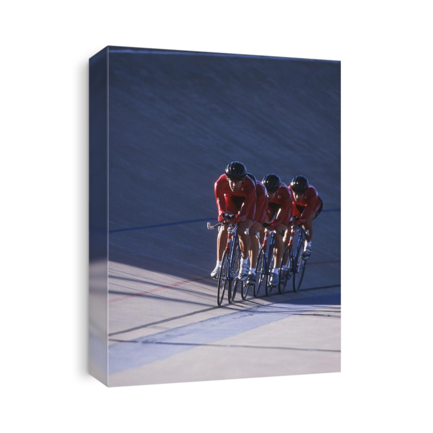 Male cycling team on the velodrome.