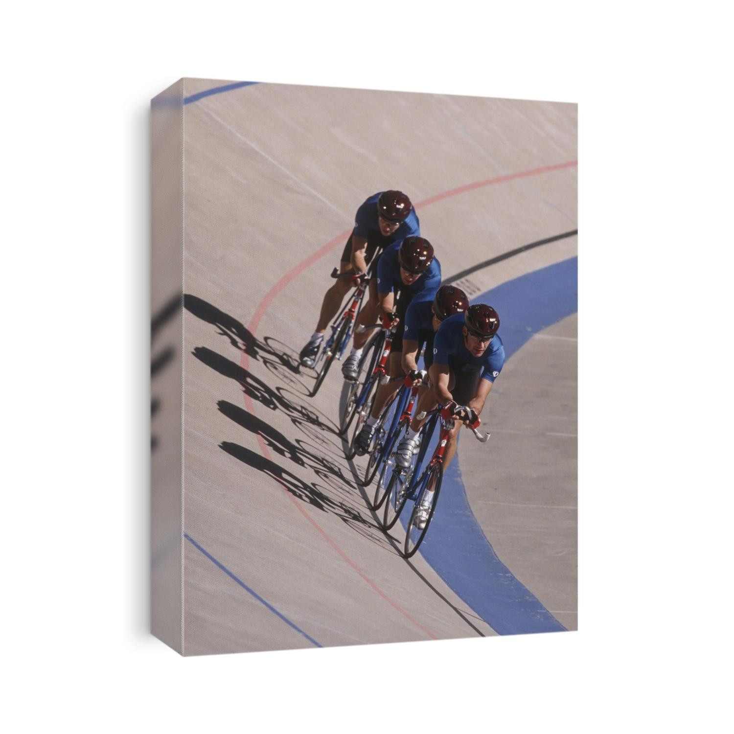 Male cycling team on the velodrome.