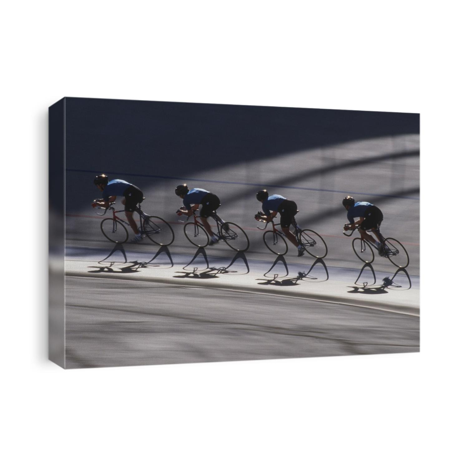 Male cycling team on the velodrome.