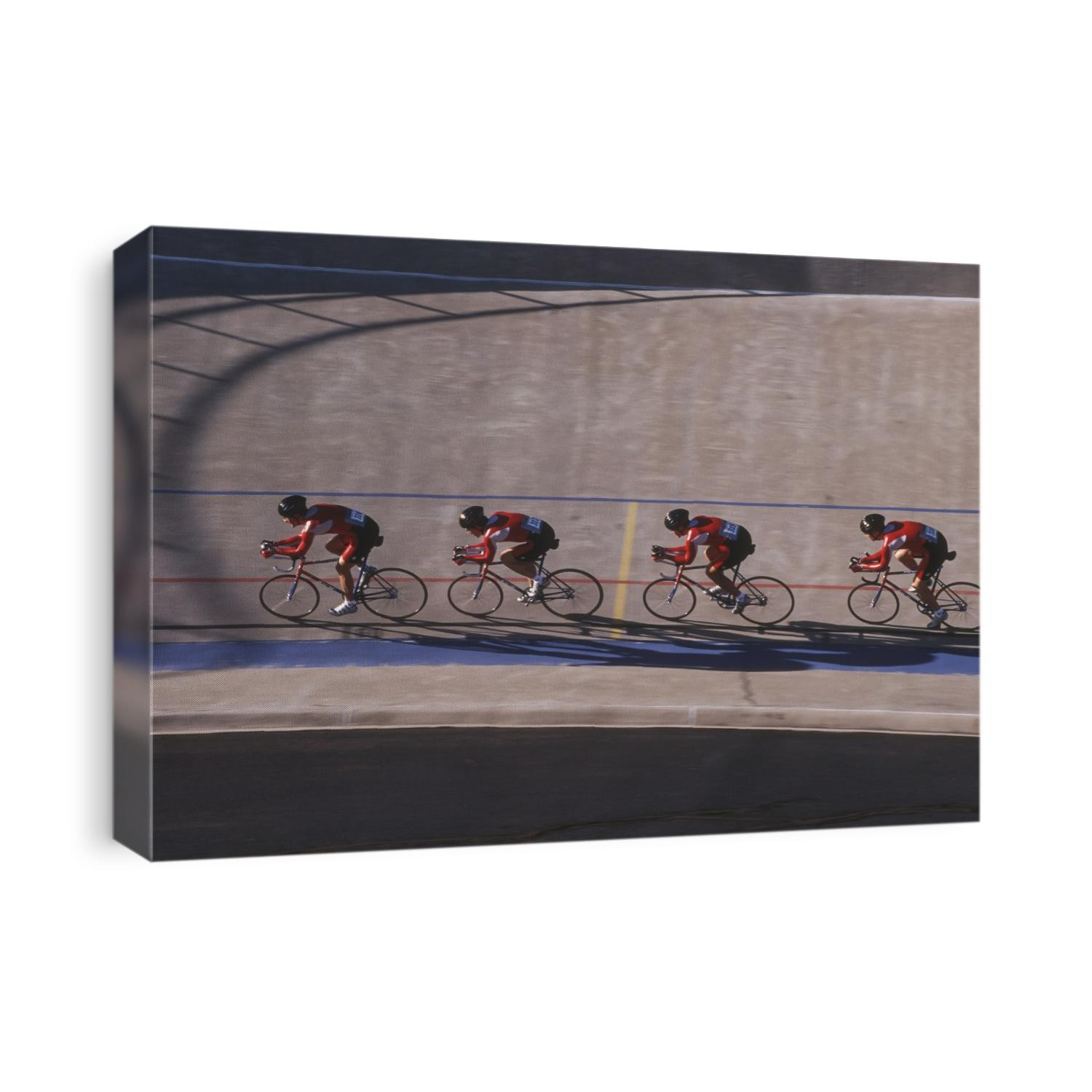 Male cycling team on the velodrome.