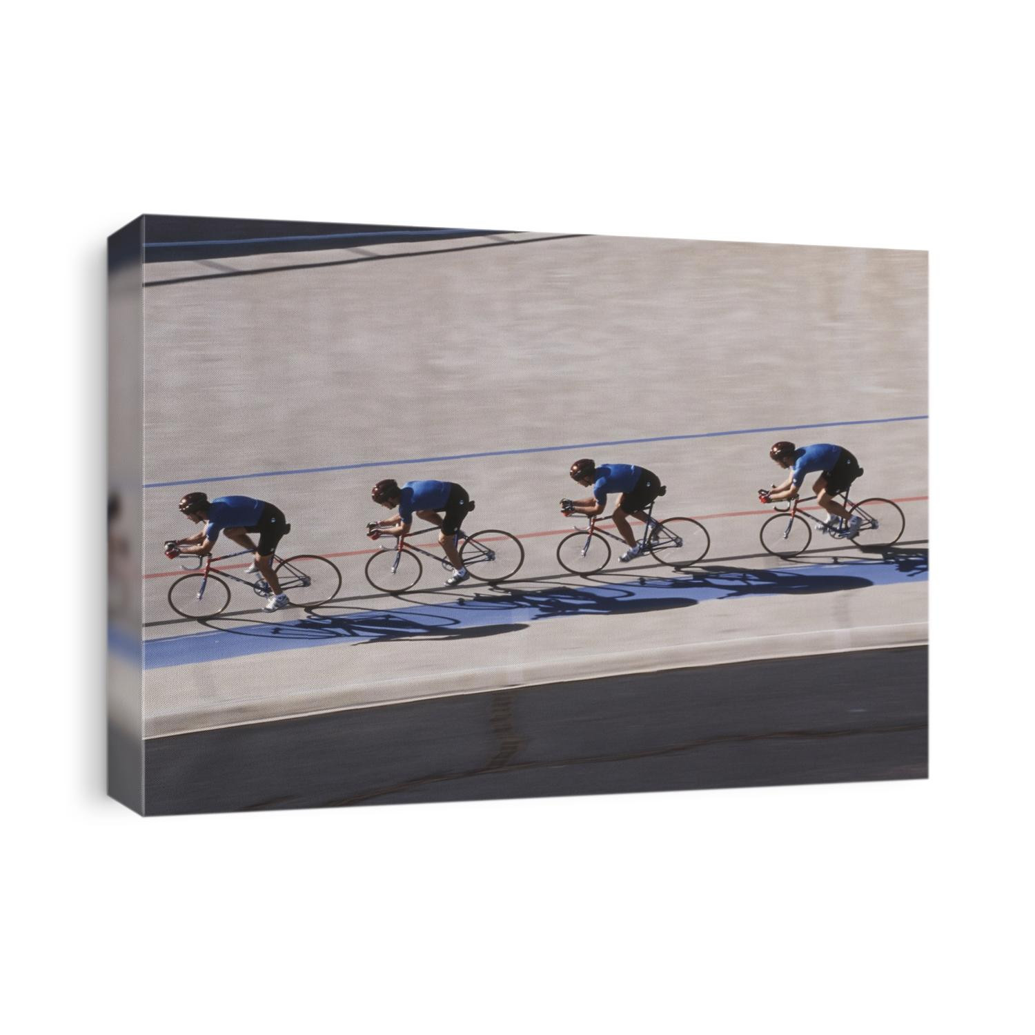 Male cycling team on the velodrome.