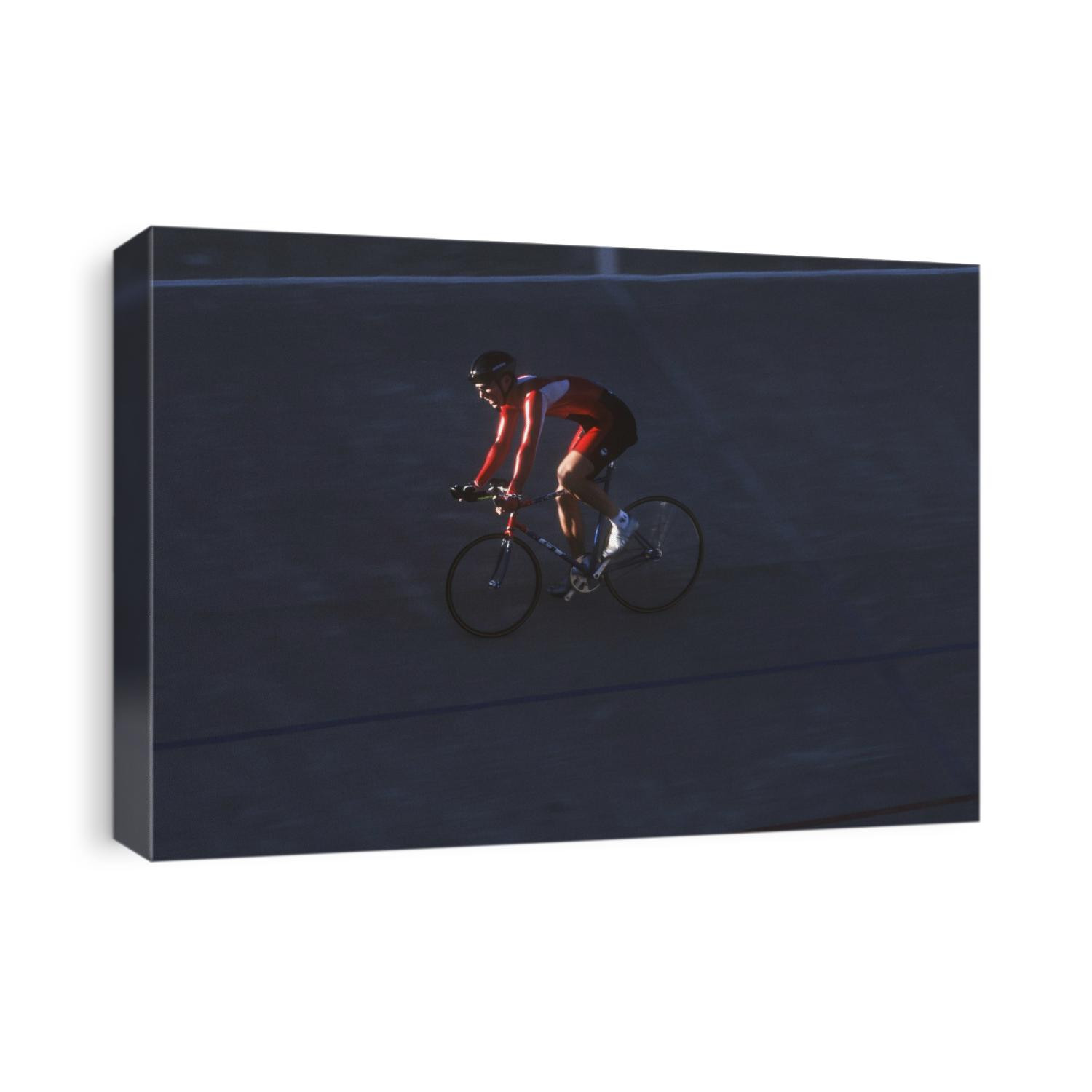 Male cyclist competing on the velodrome.