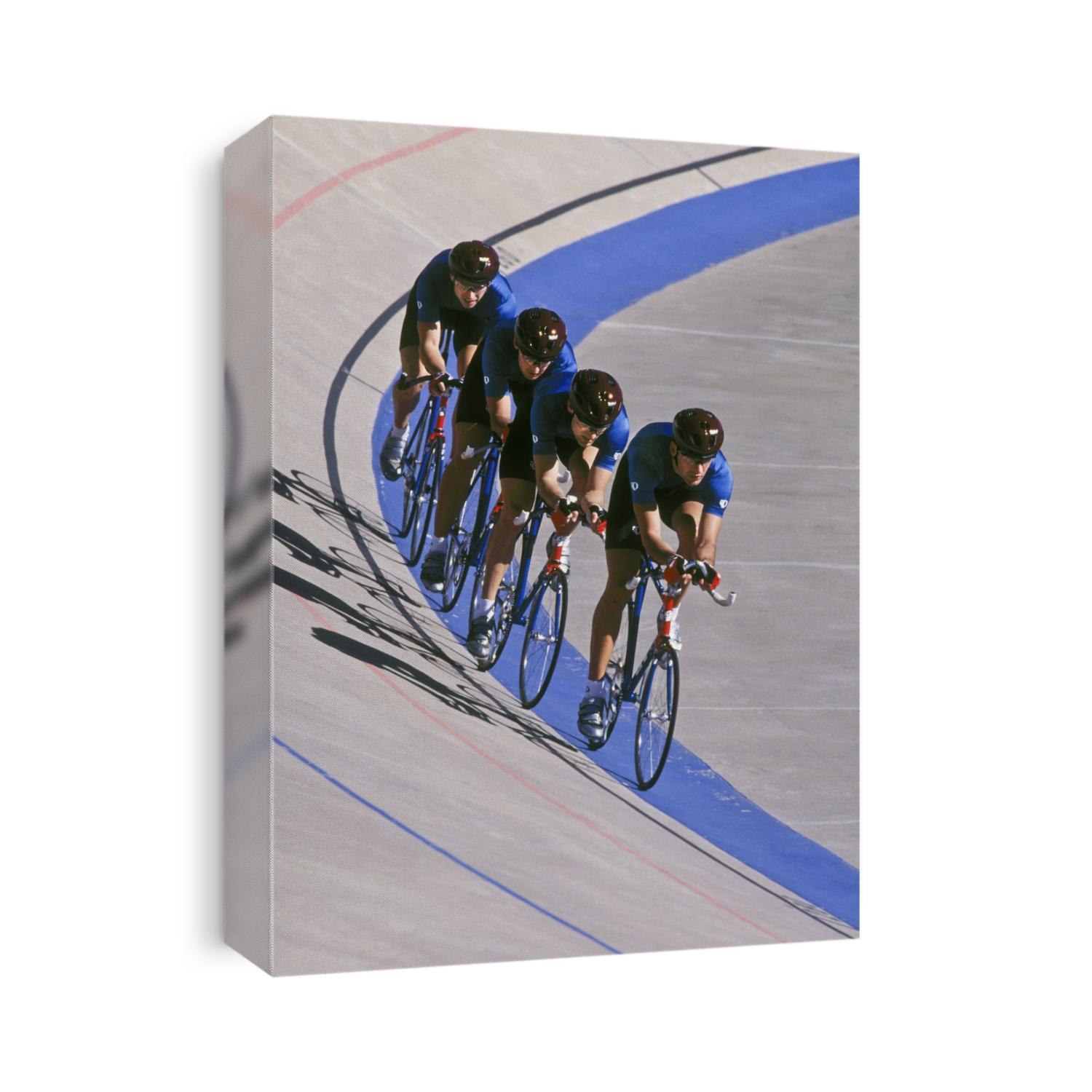 Male cycling team racing on the velodrome track.