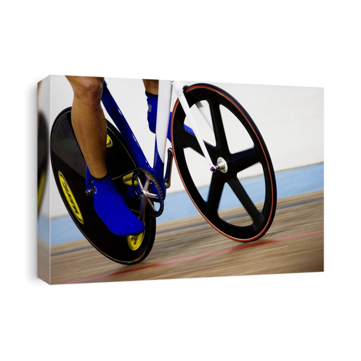 Detail of cyclist racing on the velodrome track.