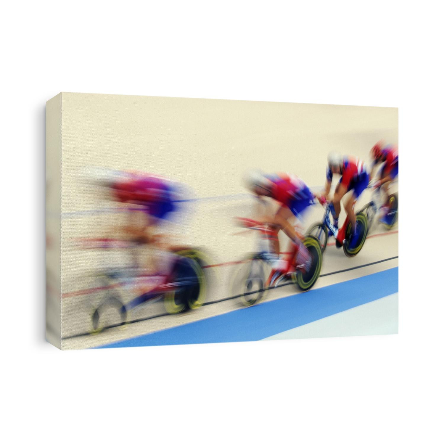 Blurred action of cycliing team on the track.