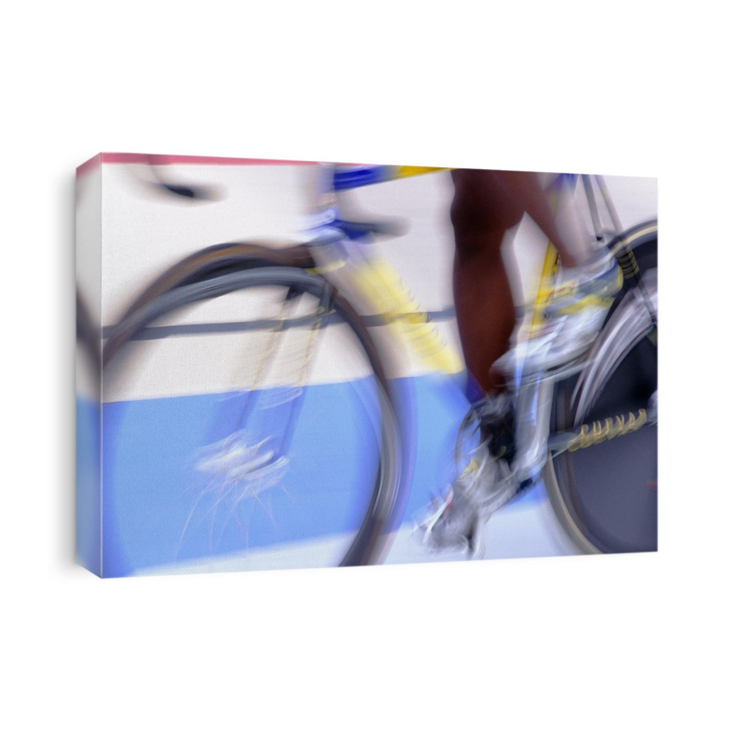 Detail of blurred action of cyclist on velodrome.
