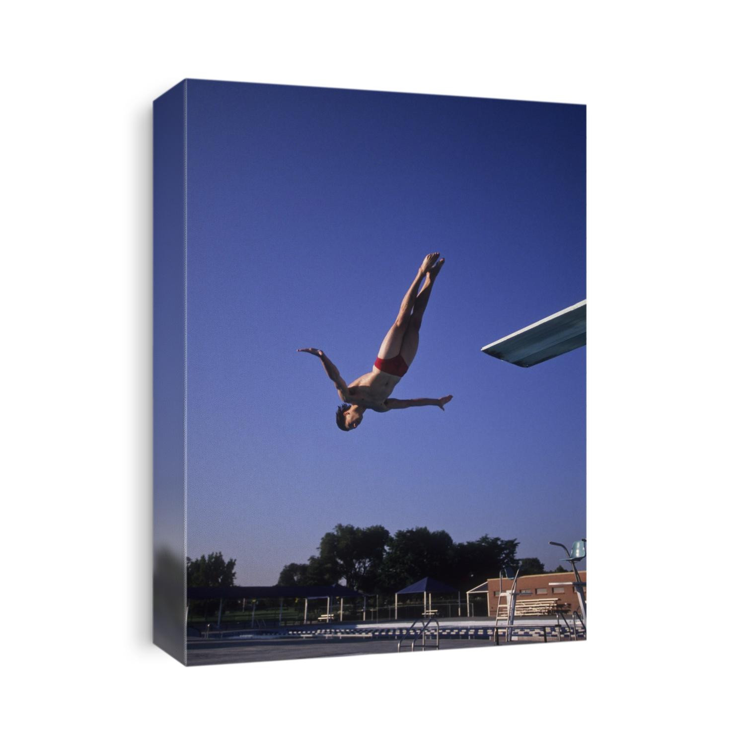 Action of male diver in the air.