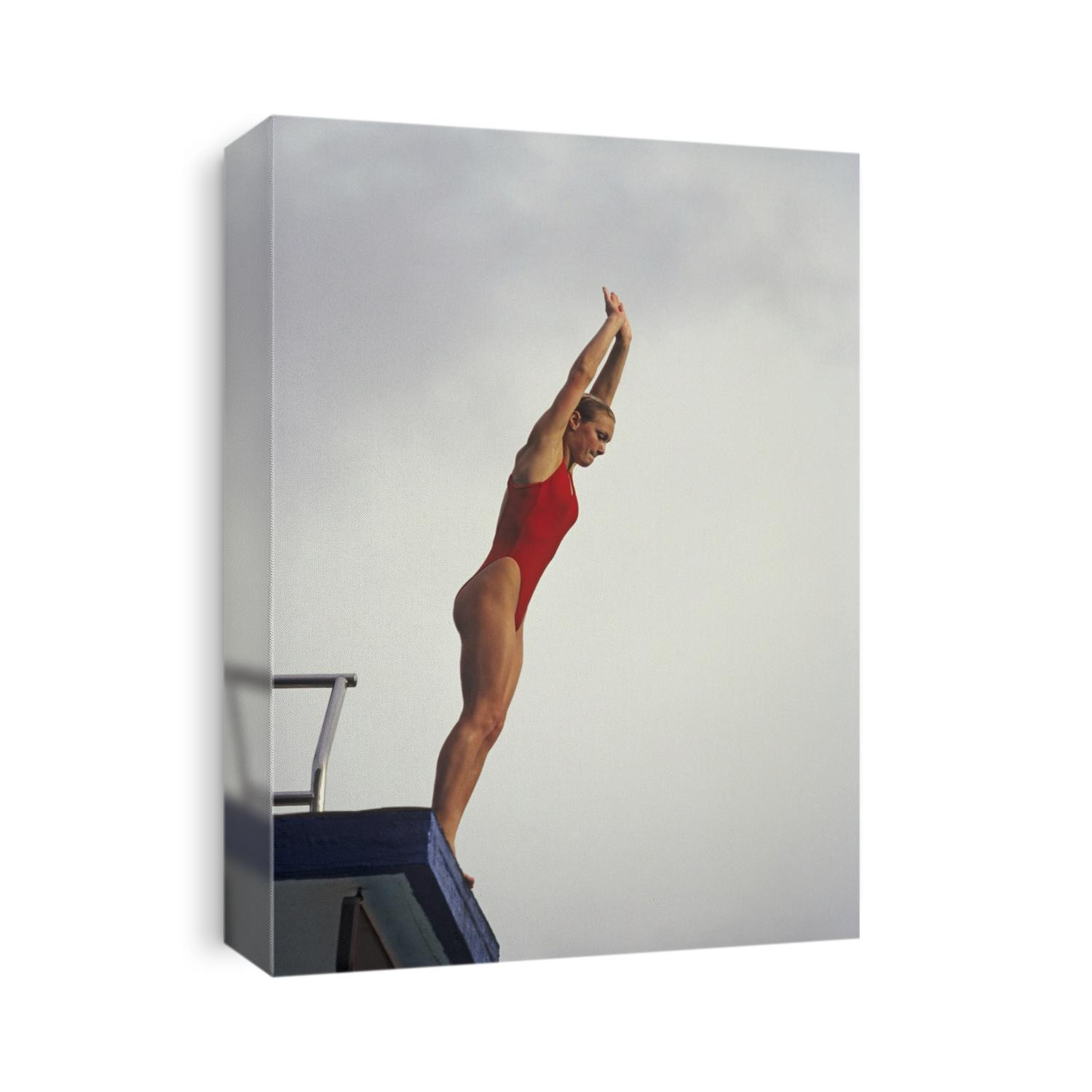 Women diver preparing to jump off the platform.