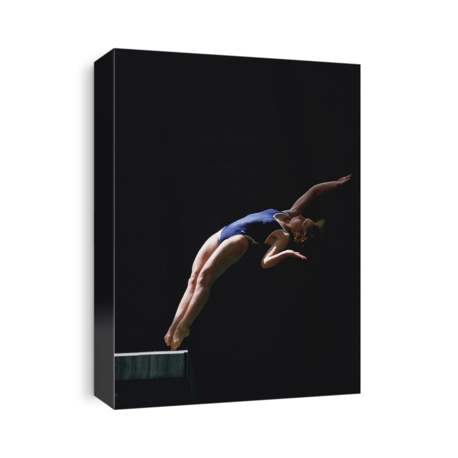 Young girl diving off the 10m platform.