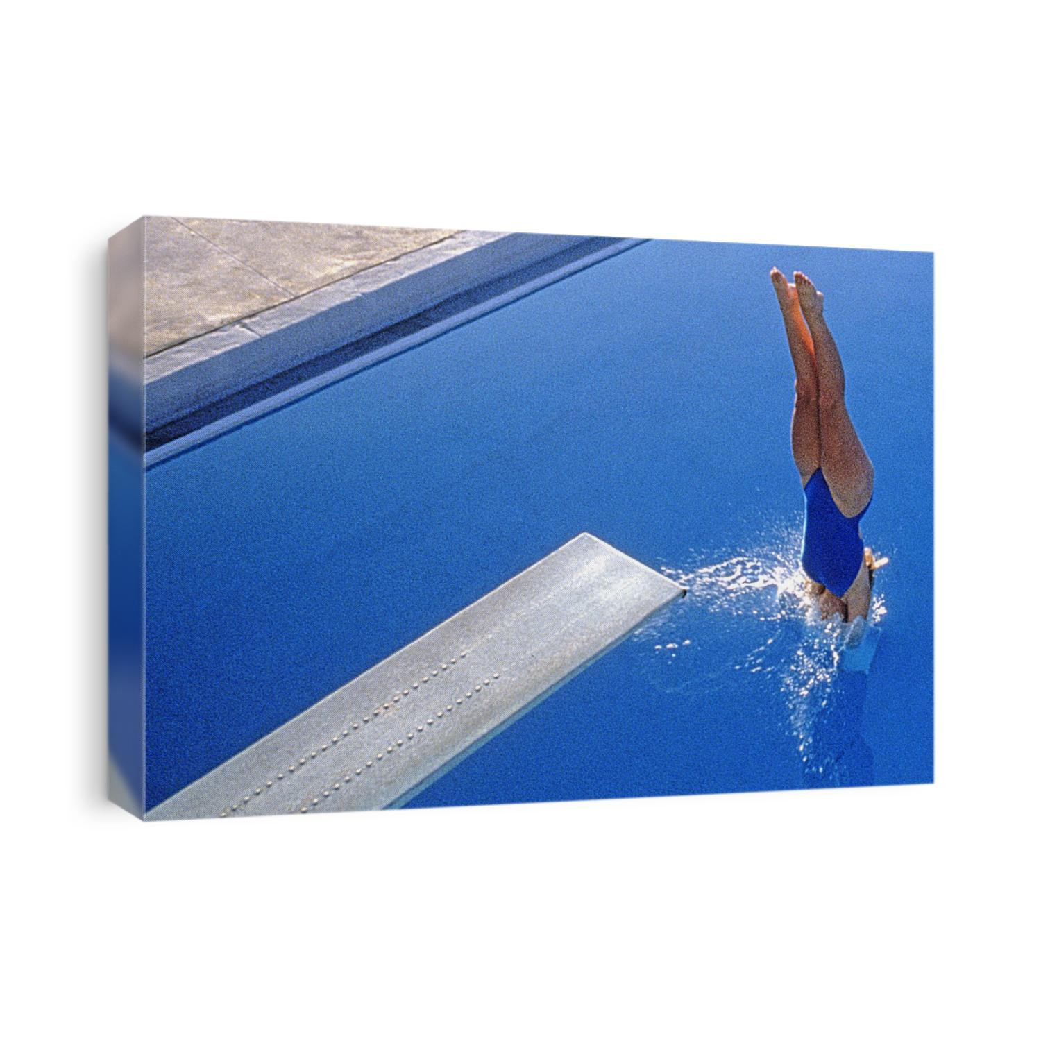 Women diving into the pool.