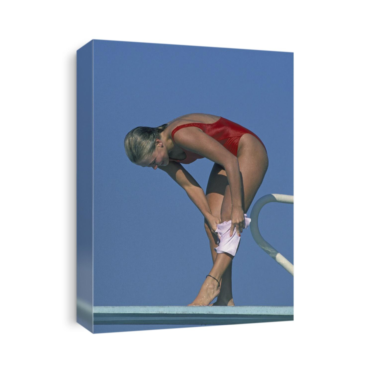 Woman preparing to dive off spingboard
