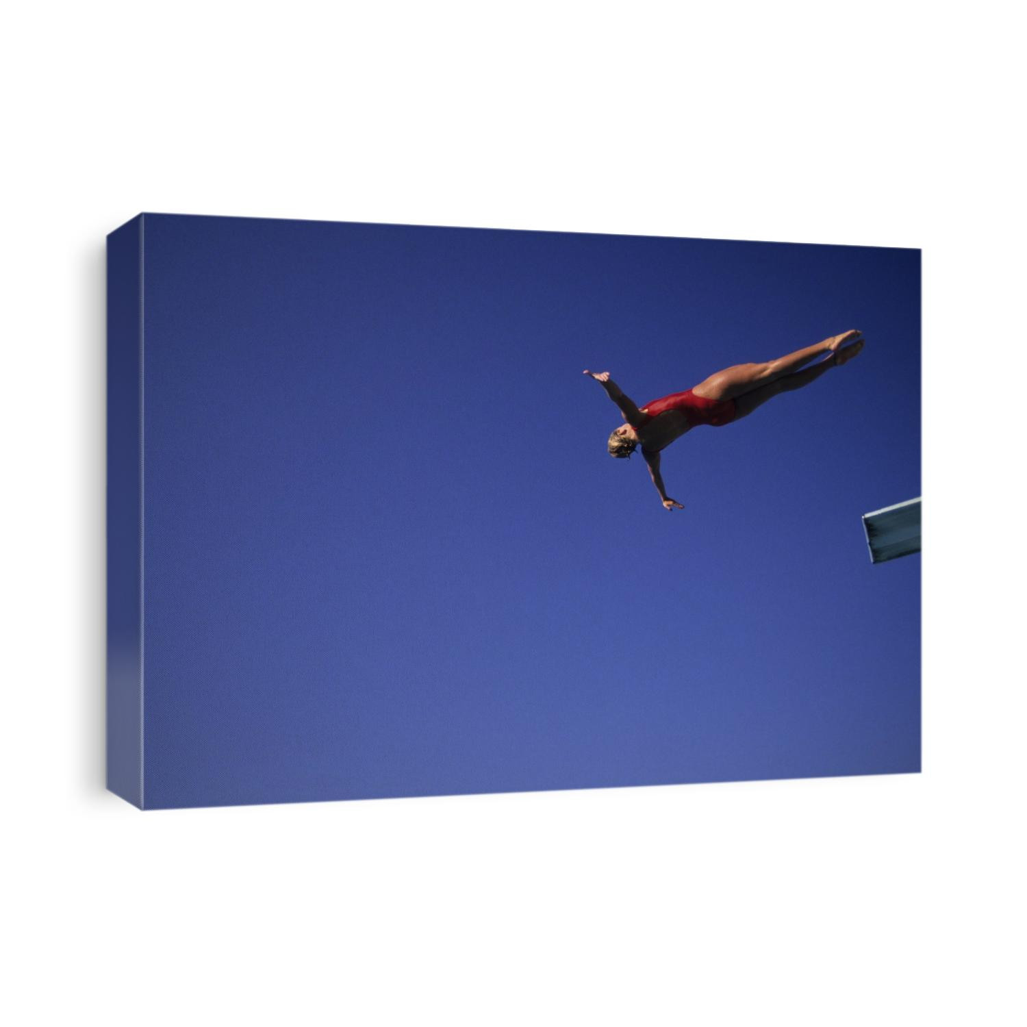 Woman diver flying through the air.