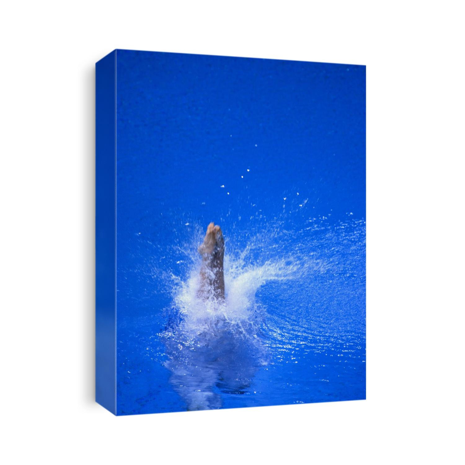 Divers feet at monment of imapct into the water