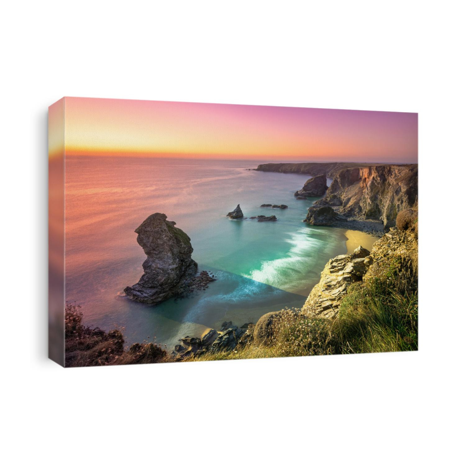 Sunset at Bedruthan Steps. Carnewas and Bedruthan Steps is a stretch of coastline located on the north Cornish coast between Padstow and Newquay, in Cornwall, England, United Kingdom