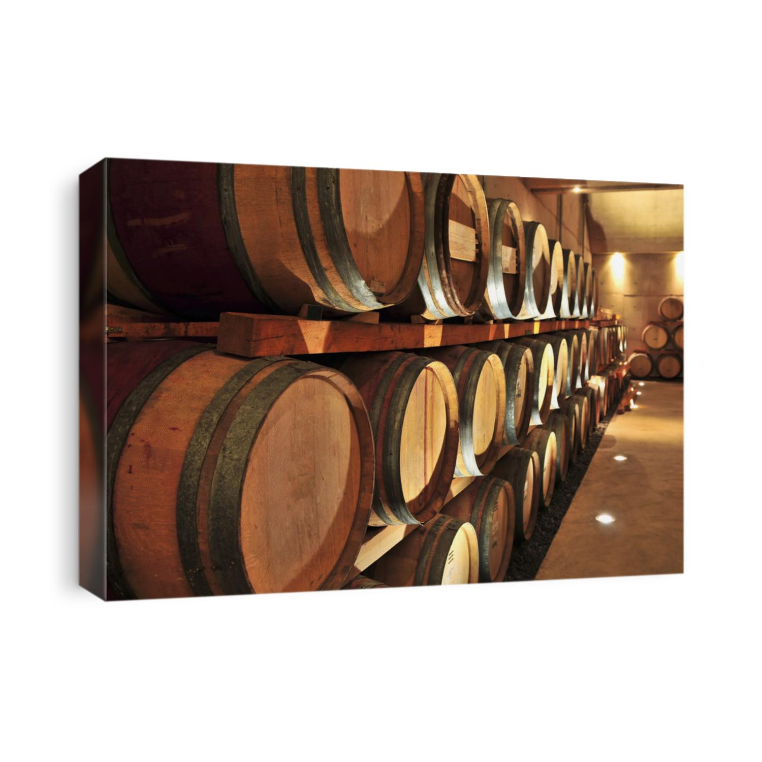 Stacked oak wine barrels in winery cellar