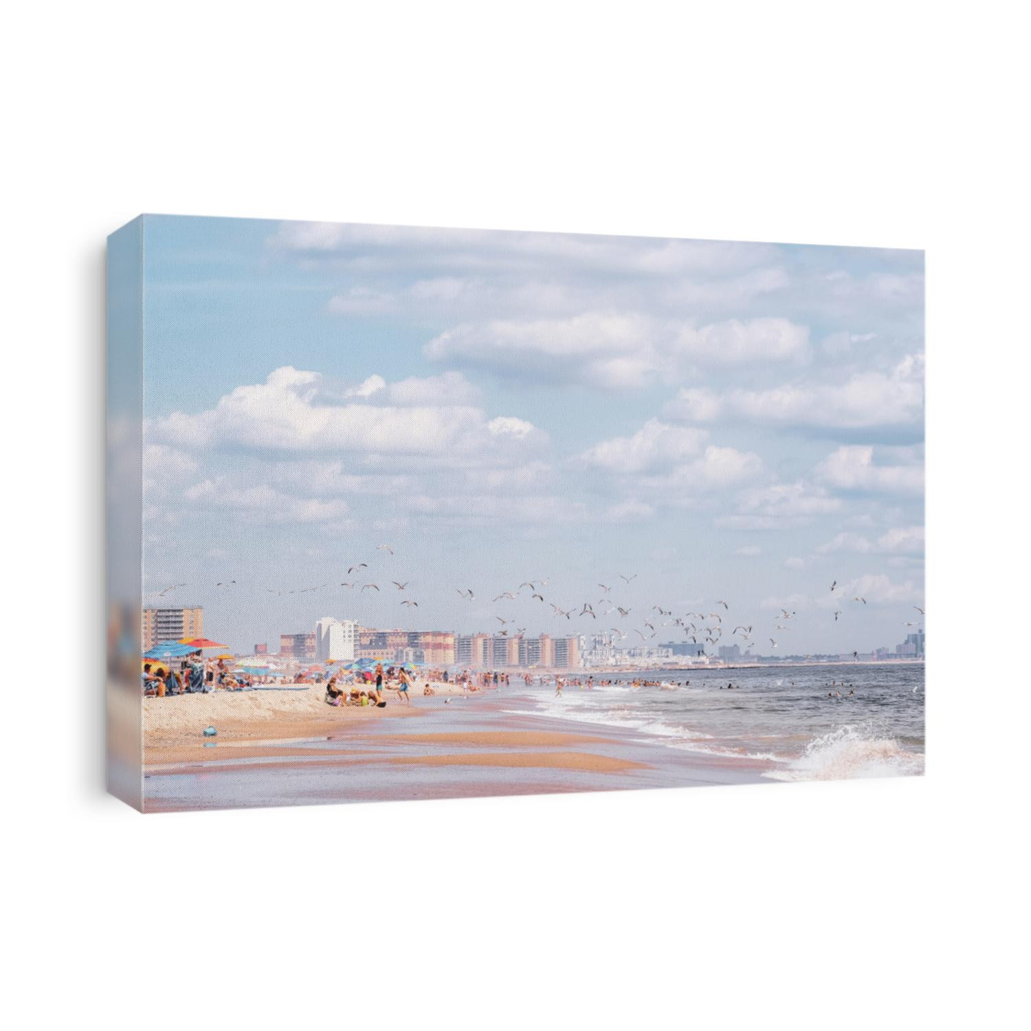 Rockaways, Queens, New York beach front and ocean during summer. Blue skies and white sand.