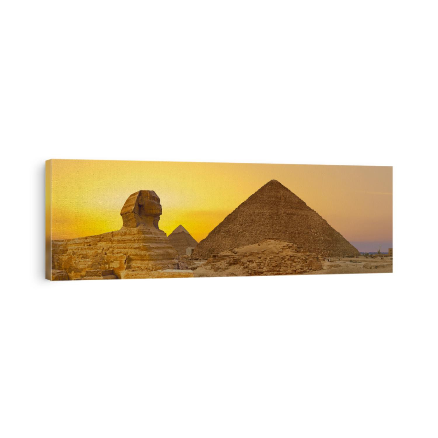 Sphinx against the backdrop of the great Egyptian pyramids. Africa, Giza Plateau.