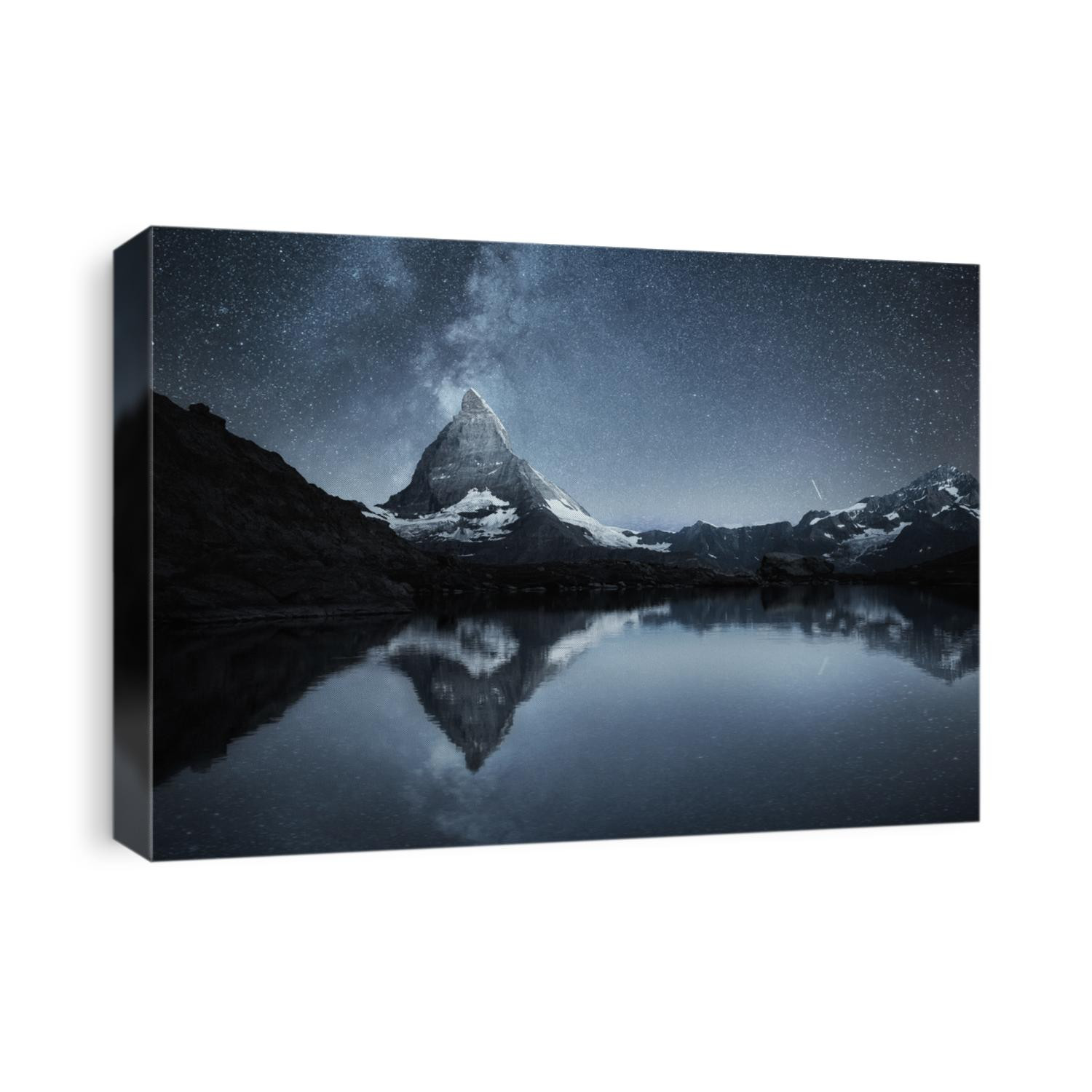 Swiss landscape. Matterhorn and reflection on the water surface at the night time. Milky way above Matterhorn, Switzerland. Travel image. 