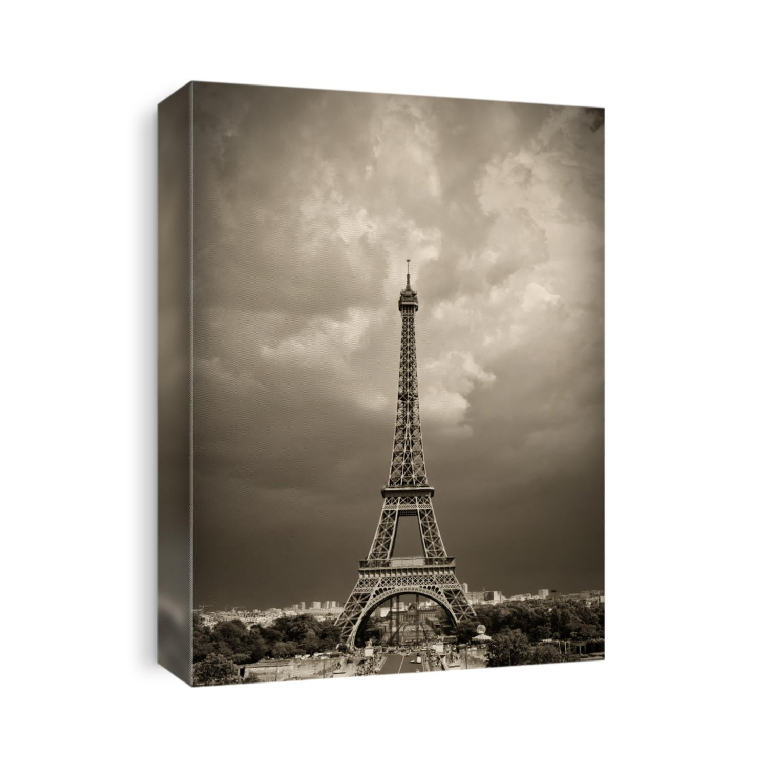 Vintage styled image of Eiffel tower during daytime, sepia toned against the dramatic sky. Paris, France