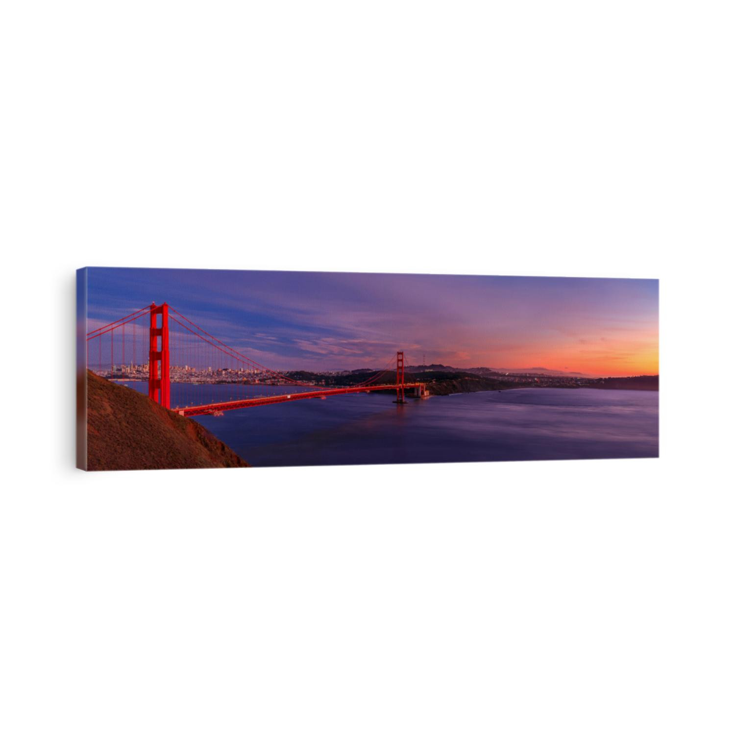 Panorama of the Golden Gate bridge at sunset with the Marin Headlands in the foreground, San Francisco skyline and colorful clouds in the background