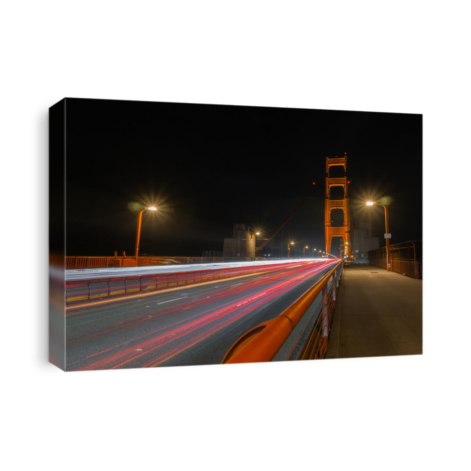 Golden Gate Bridge at night. Long exposure of speeding traffic. Empty pedestrian walkway. 