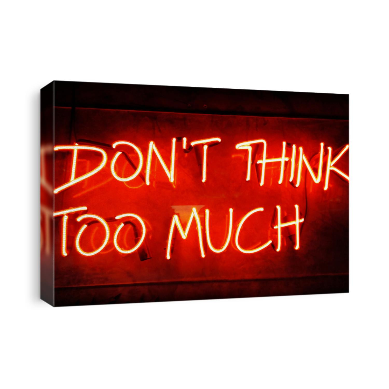 Illuminated neon sign showing DON'T THINK TO MUCH on black background